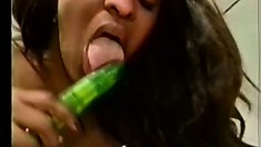 Filthy whore sticks green dildo into wet puss and licks clit