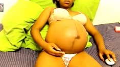 Heavily pregnant black cam chick
